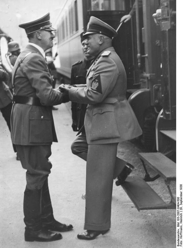Adolf Hitler greets Benito Mussolini in Munich's station at their arrival before the Munich conference